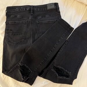 American Eagle Black Skinny Jeans with distressing on knees, size 10